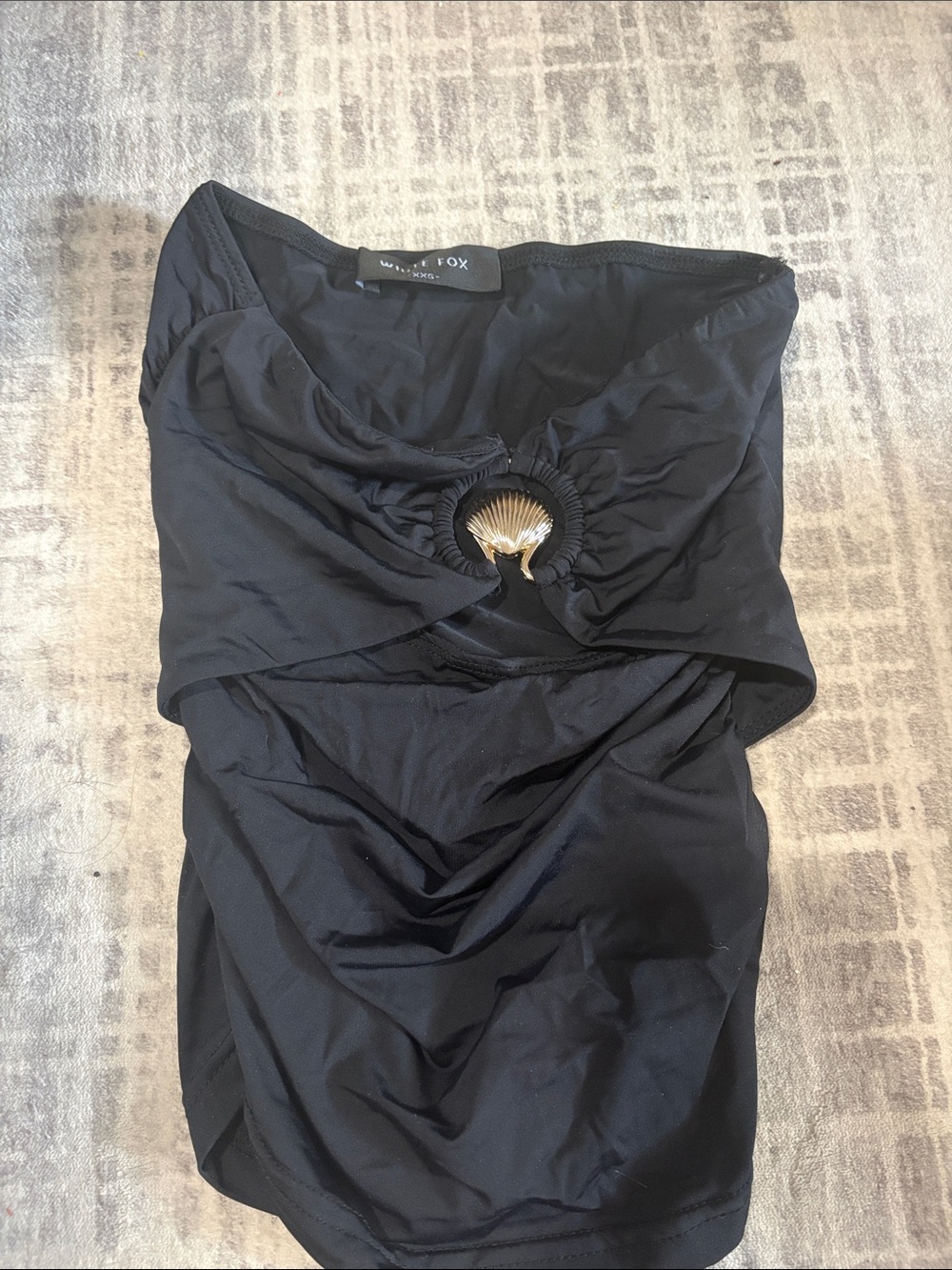 White Fox Boutique Black Strapless Ruched Crop Top with Gold Shell Accent